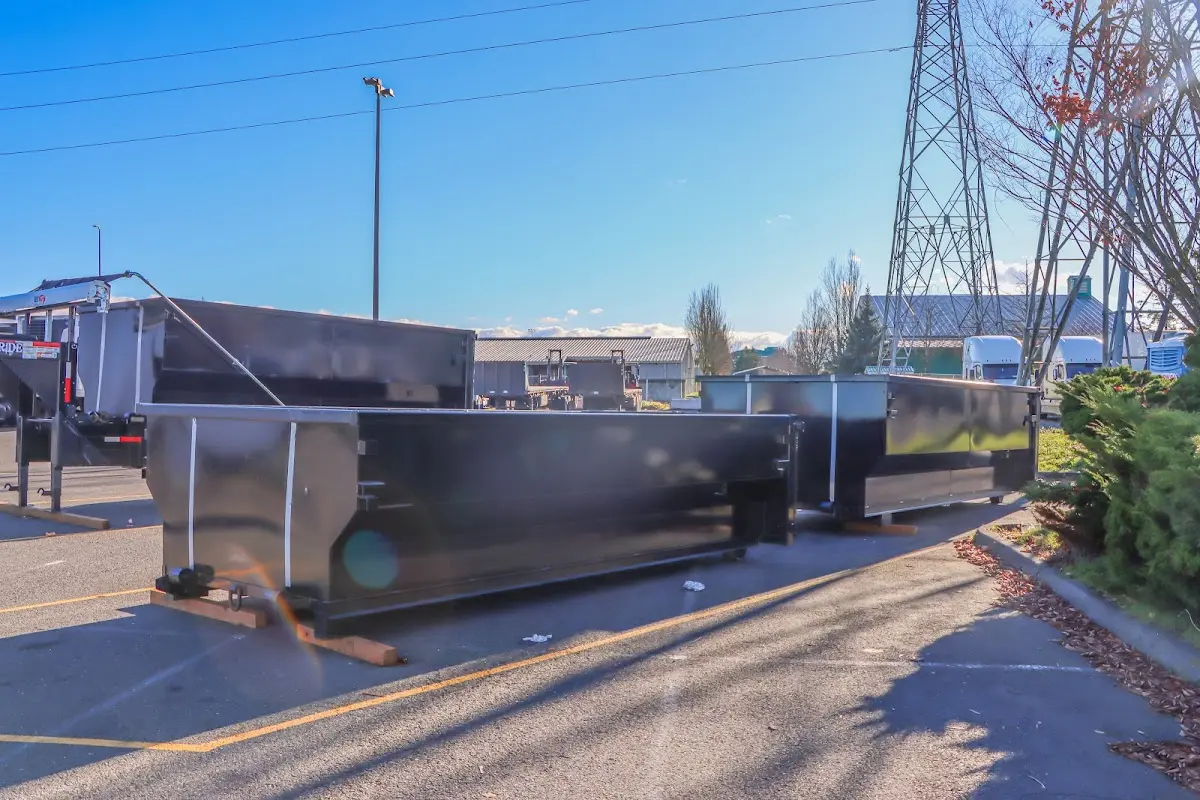 Roll-off dumpster ready for waste disposal at job site for Concrete Dumpster Rental in Belmont